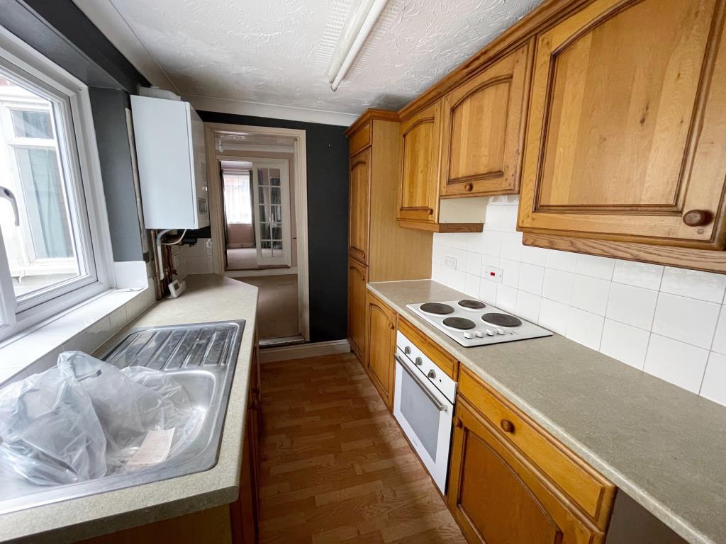 Lot: 126 - TERRACE HOUSE FOR IMPROVEMENT IN COLCHESTER CITY CENTRE - Kitchen with double glazed window to side and gas boiler